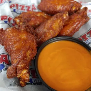 Naked wings with buffalo sauce on side