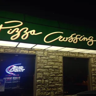 a neon sign for a pizza restaurant