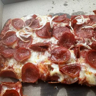Pepperoni and onion pizza