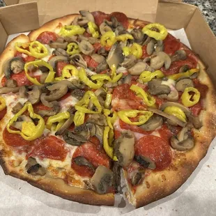 Large with pepperoni, ham, mushrooms and banana peppers. What's great!