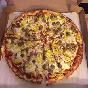 Jumbo pizza with ground beef meatballs, banana peppers, mushrooms, and onion