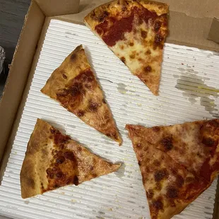 Baby slices of pizza and mostly crust and sauce