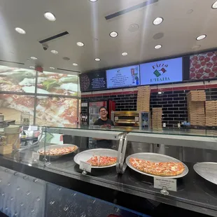 pizzas on display in a restaurant