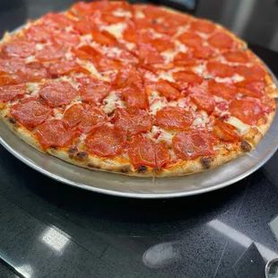 a pepperoni pizza on a plate