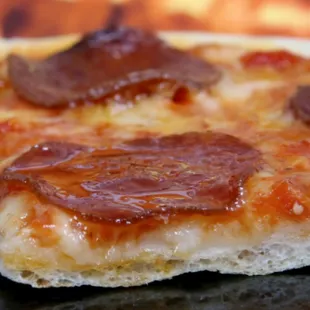 a slice of pepperoni pizza