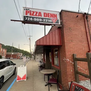 a car parked in front of a restaurant