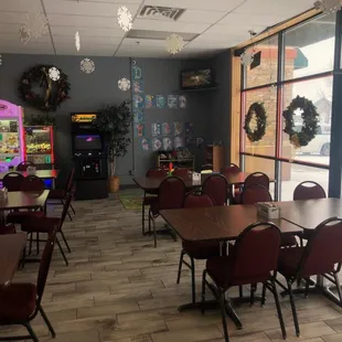 tables, chairs, and a vending machine