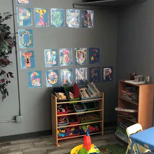 a child's playroom with toys
