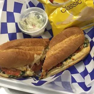 a sandwich and chips on a tray
