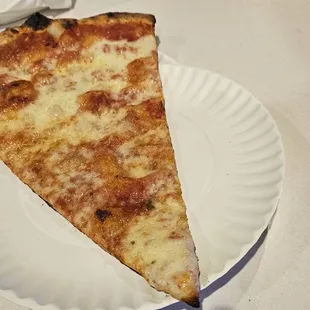 a slice of pizza on a paper plate