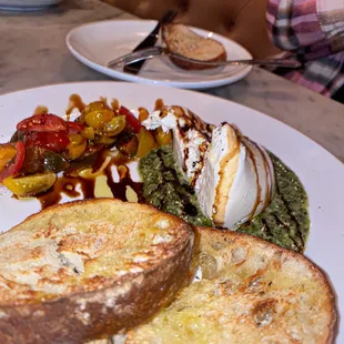 two slices of bread and a salad on a plate