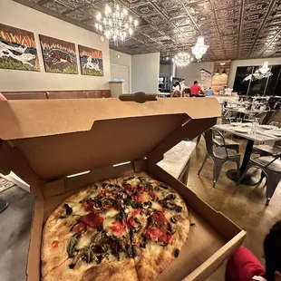 a pizza in a pizza box