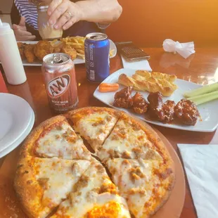 This the 10" Pizza and 5 Wings combo which comes with Bread Sticks and a can of soda.