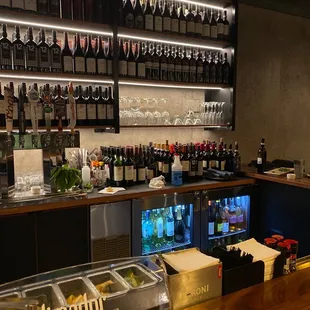 a bar with a lot of bottles of wine