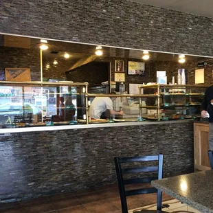 a man standing in front of a counter