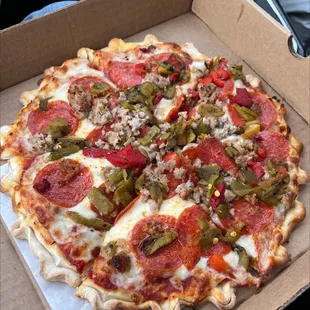 Slice of Pepperoni, Sausage and Green Chile Pizza