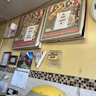 a clock and menus on the wall