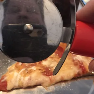 Get your own mini pizza cutter table side.  Kind of a cool pic I think! Lol