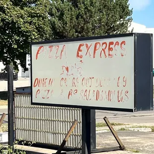 a sign on the side of the road