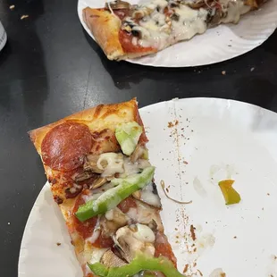 Single slice but we were given two smaller slices. We had already eaten one slice each. Yum. Pepperoni, mushroom and bell pepper pizza.