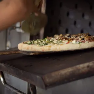 Pizza going in. All fresh ingredients.