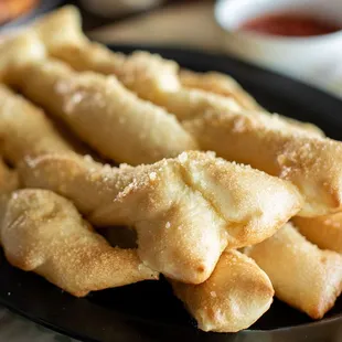 a plate of french fries and dipping sauce