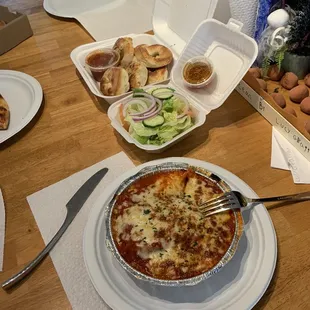 Lasagna, salad and not so garlic rolls.