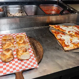 a pizza on a cutting board