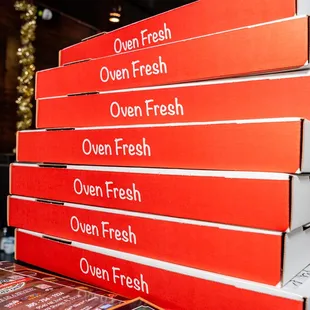 a stack of pizza boxes