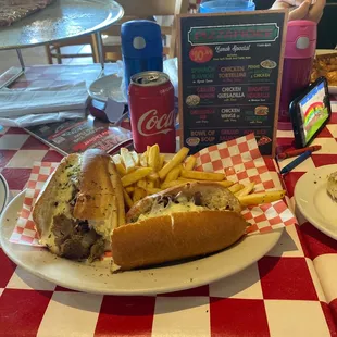 Cheesesteak sub with fries and drink