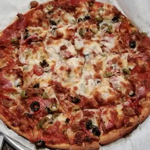 Double crust meat lovers with black and green olives. Very tasty pie!