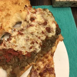 a slice of pizza on a plate