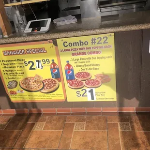 menus and prices on a counter