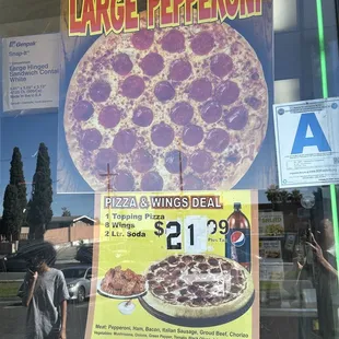 a large pepperoni advertisement in a store window