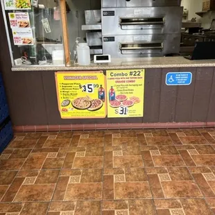 the counter of a pizza restaurant