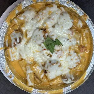 Baked rigatoni over Rose cream with grilled chicken!! Absolutely delicious!!