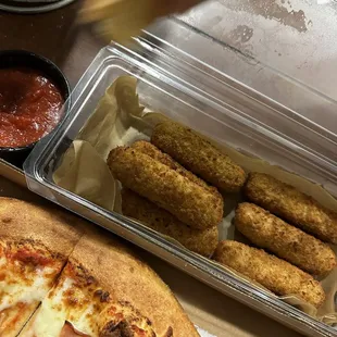 a pizza with cheese, meat, and sauce