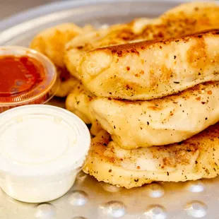 a plate of food with a side of ketchup