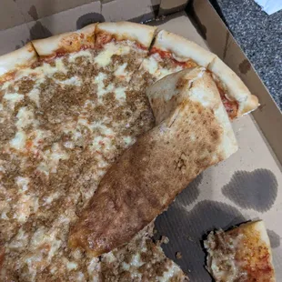 a half eaten pizza in a box