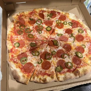 Large pepperoni and jalapeño pizza