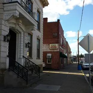 Store front as of 5/8/2017.  Old police station in the foreground, hence the informal name "Police Station Pizza".