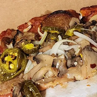 a slice of pizza in a box