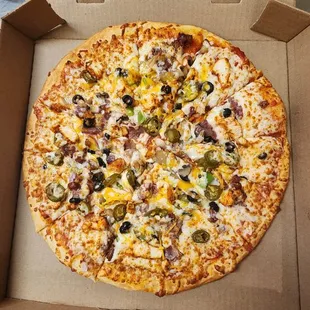 a pizza in a cardboard box