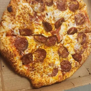 Pepperoni pizza is a classic favorite, topped with spicy pepperoni slices that sizzle and crisp to perfection.