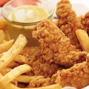 a basket of fried chicken and french fries