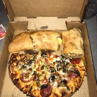 a pizza in a cardboard box