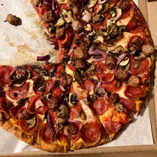 a half of a pizza in a box