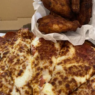 a slice of pizza and a basket of fries