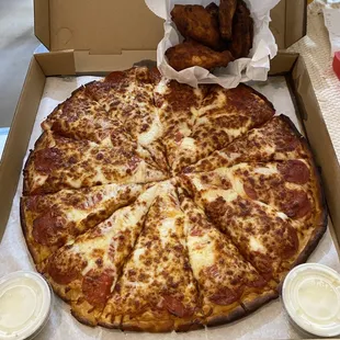 Pepperoni pizza with extra cheese and extra pepperoni. Wings came plain without Buffalo sauce which was disappointing.