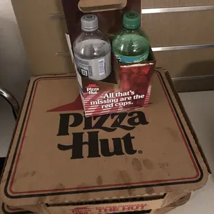 a box of pizza and a bottle of water